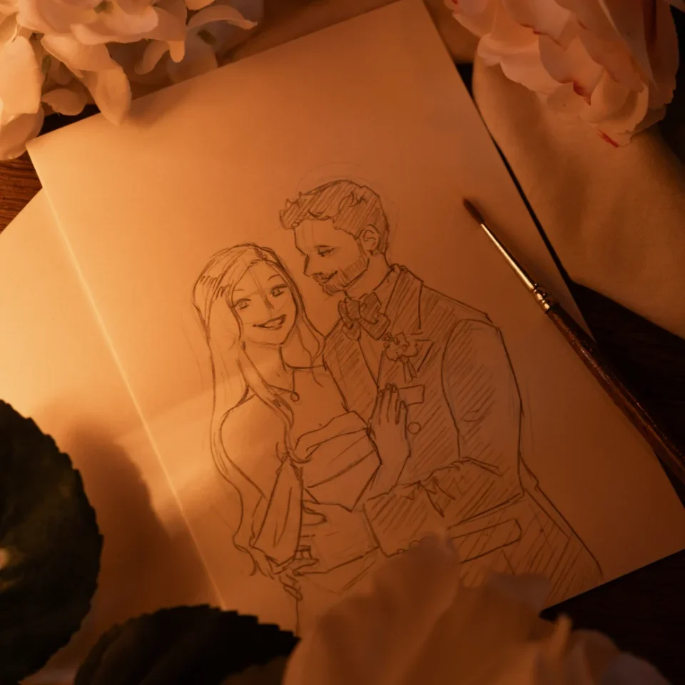 Croquis d'un couple marié, avec un pinceau et des fleurs